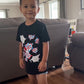 Child wearing the black Spider-Man graphic T-shirt