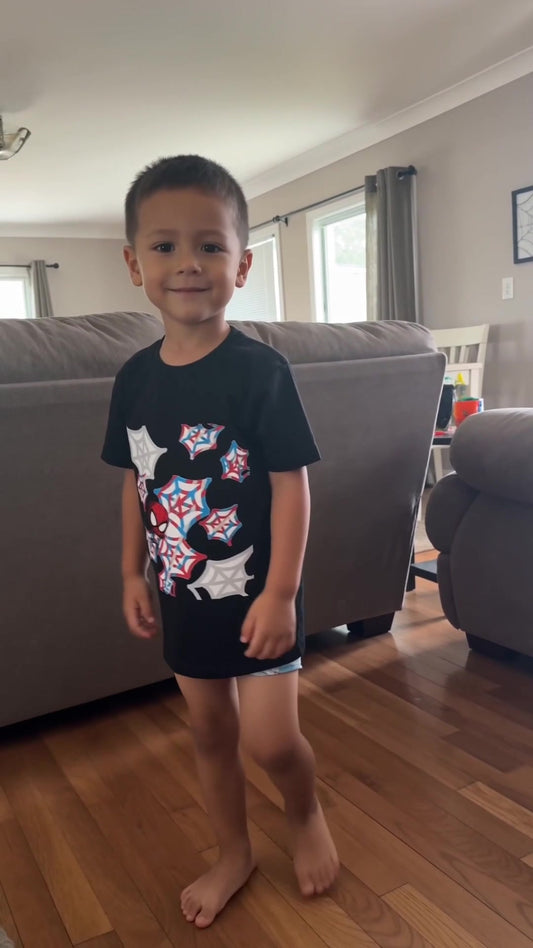 Child wearing the black Spider-Man graphic T-shirt