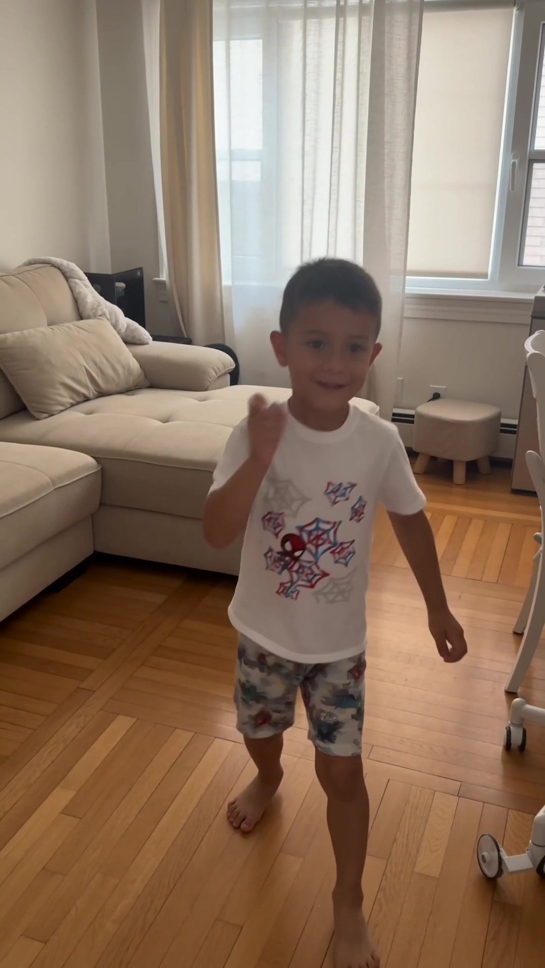 Child wearing the white Spider-Man graphic T-shirt